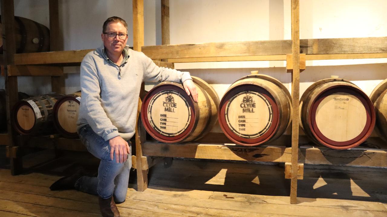 John Ramsay with barrels of Clyde Mill whisky