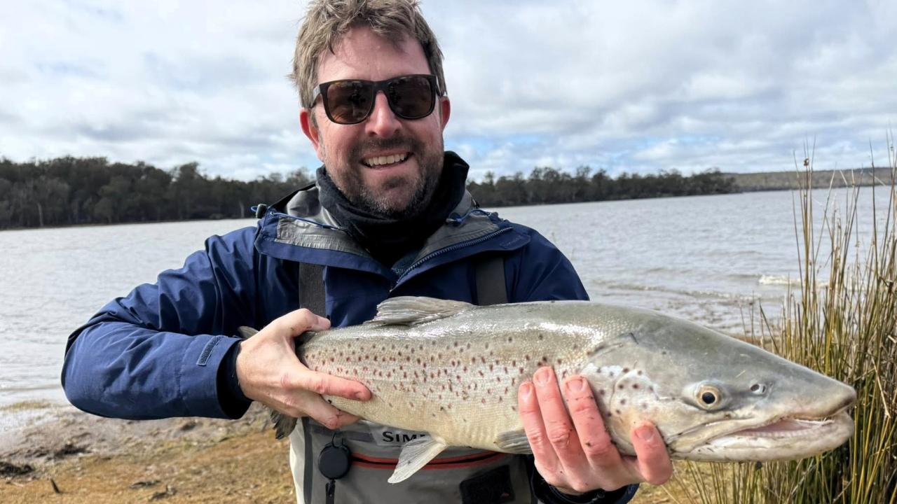 Peter Bradnam with a solid male brown trout he landed and then released after a big fight from the shore at Lake Crescent recently