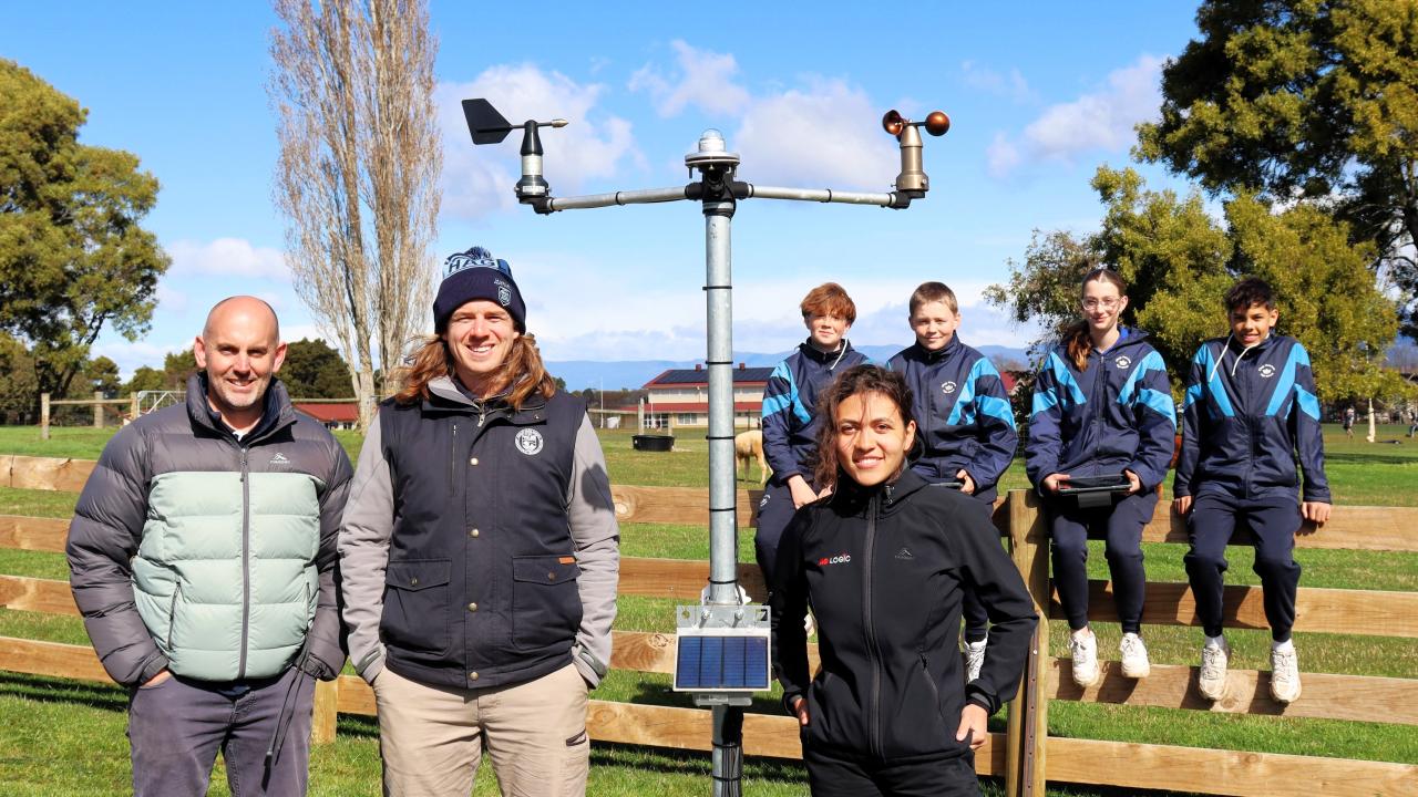 Kings Meadows High School students Baxter Manshanden, Bryce Austin, Gypsy Fitzallan and Olive Keating watch on as Kings Meadows High assistant principal Brendan Poke, Hagley Agriculture Learning Centre co-ordinator Liam Fox and Ag Logic field officer Chelsea McDonald demonstrate the weather station