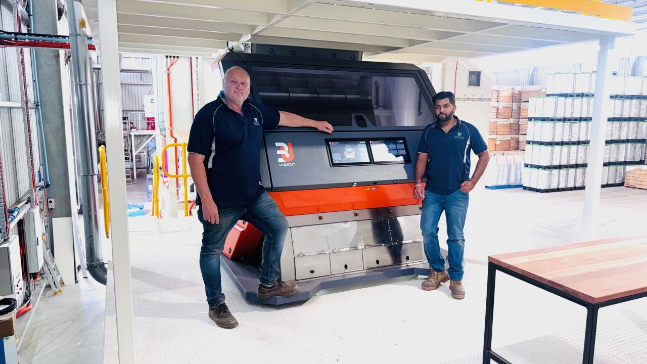 Tasmanian Seed Dressing and Storage general manager Morgan Leath and operations manager Abhi Gupta in front of the 3U Vision Fenix 4