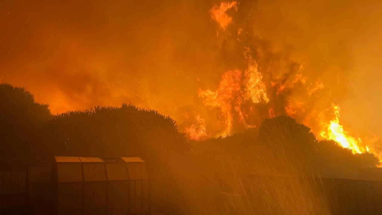 The fire front approaching Robyn Moore's house at Dolphin Sands