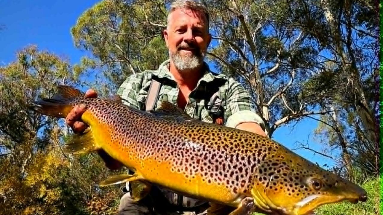Ben Hoggins and the 6kg male brown trout he caught from the Tyenna River recently