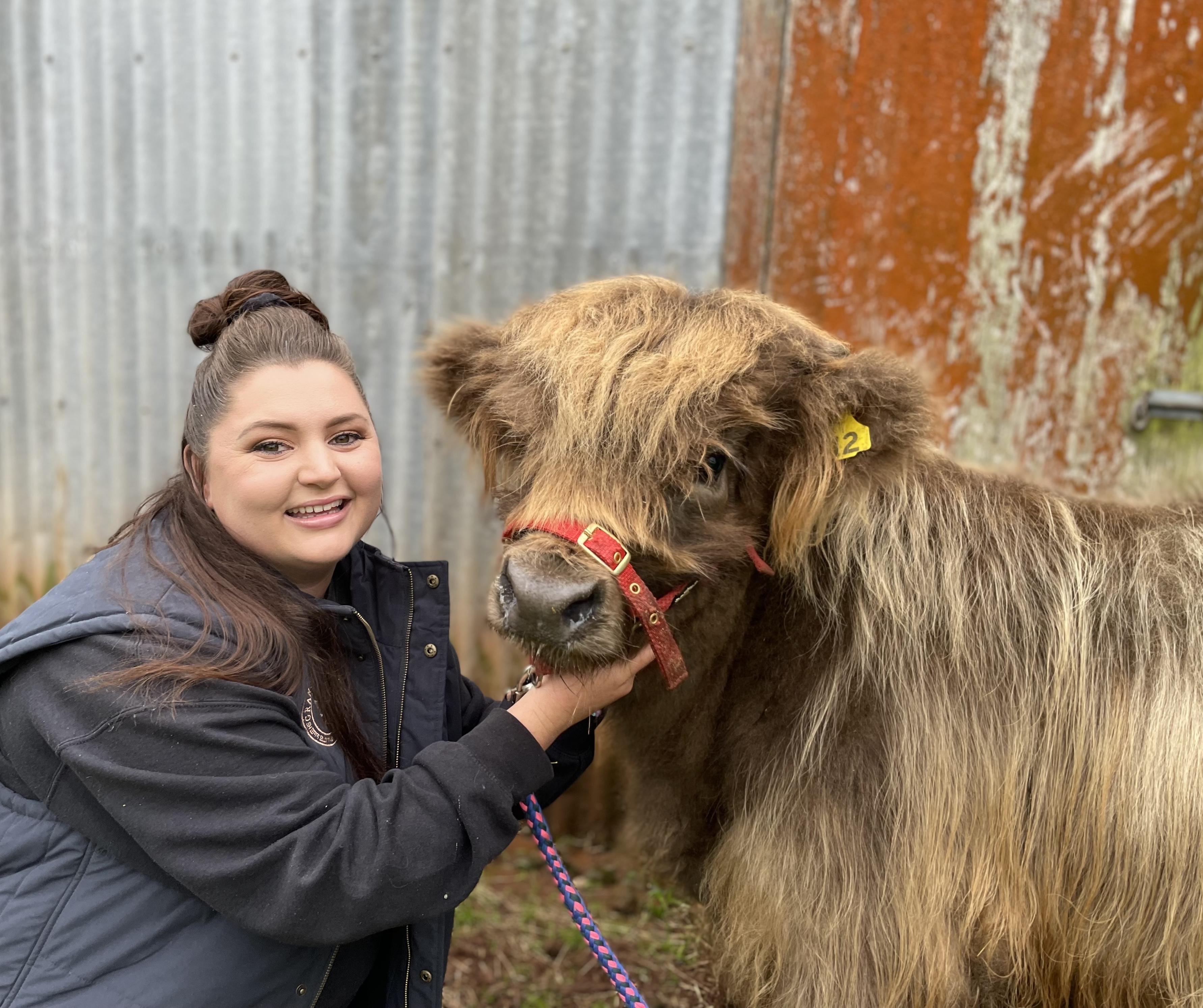 Tameka Roberts of Grange Hill Farm Highland cattle stud with one of the woolly beasts.
