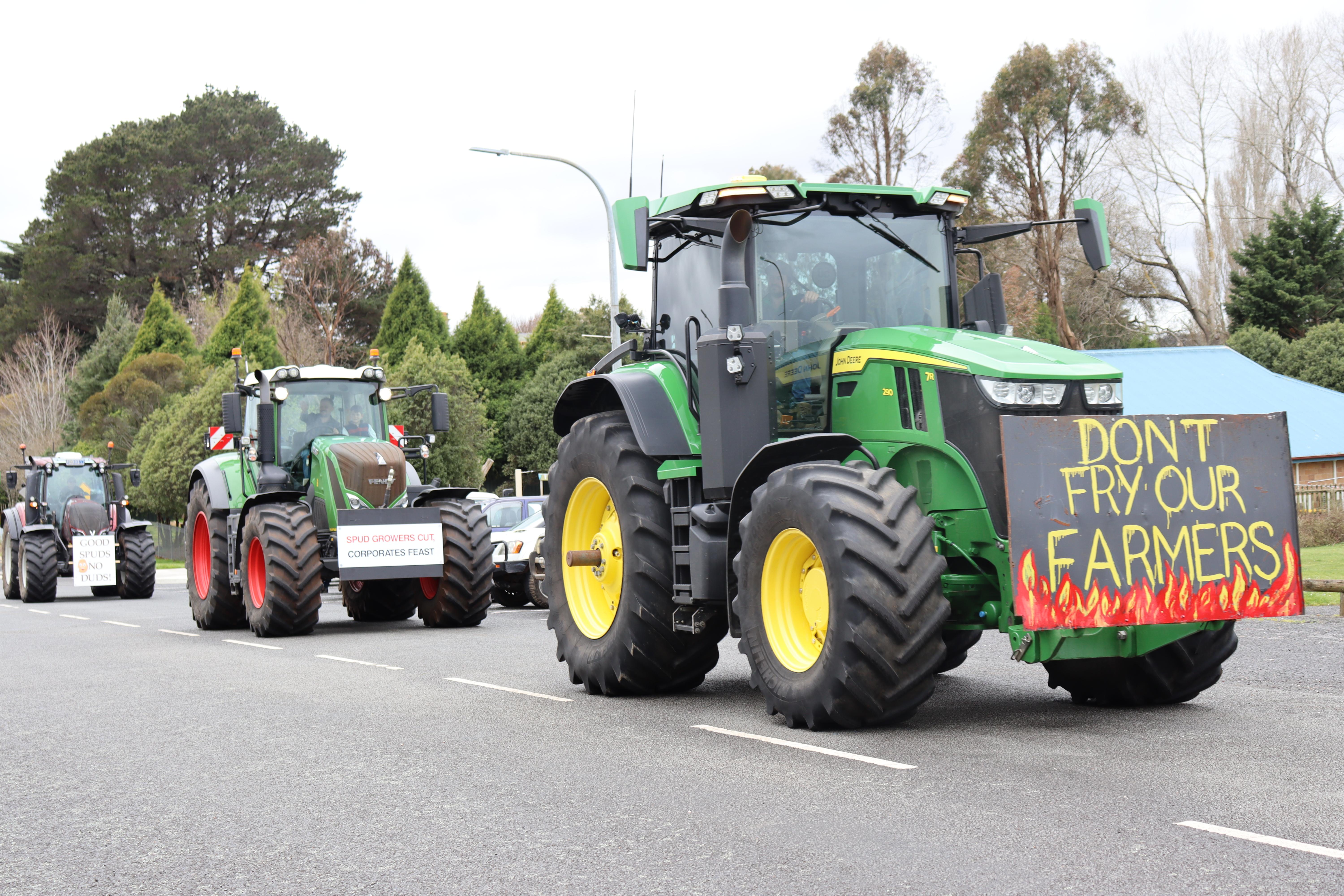 Potato farmers driving their tractors through Deloraine