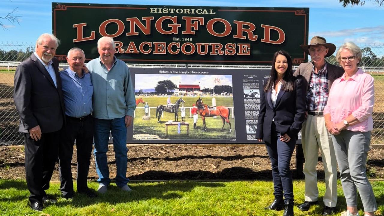 Signage Working Committee member and former racing journalist Peter Staples, Longford racing legend Max Baker, committee member Dennis Pettyfor, Racing Minister Jane Howlett, committee members Neil Tubb and Barb Baker with the new Longford Racecourse signage.