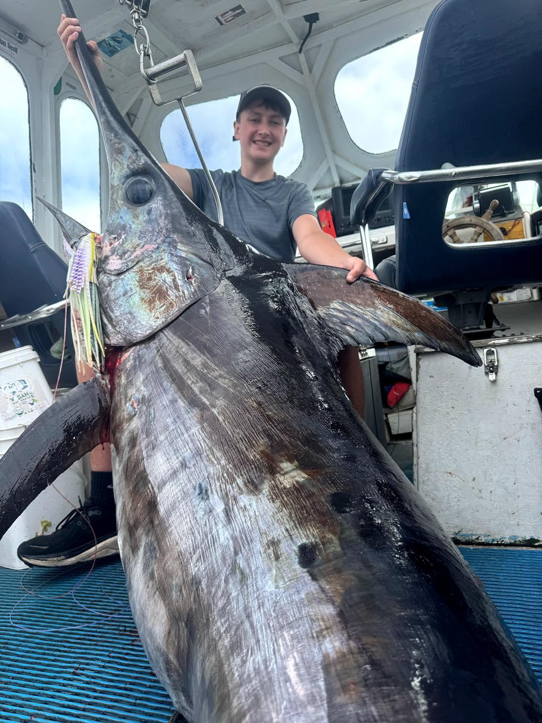 Lochie Miller with his 151kg record-breaking Broadbill Swordfish