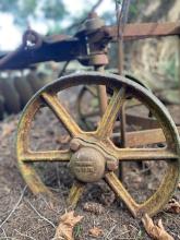 Old farm machinery is dotted around the property.