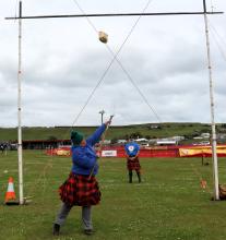Amy Jones of Elizabeth Town gets the sheaf tossed over the bar