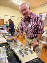 Ron Linger looking at the TMCA memorabilia.