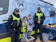 Tasmanian Police Annabel Shegog, Olivia Upston, 4, with brother Ollie, 7, and Senior Constable Brett Bowering