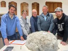 Andrew Raeber of VBC Wool, second from right, mentoring up-and coming wool classers