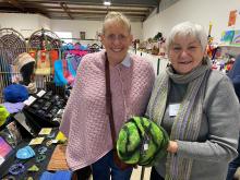Carolyn from Colours of Tasmania, right, sold handspun knitwear in the Home Industries Pavilion