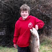 Memphys Paynter with the 9.2 kg-20.2 lb female brown trout he caught on a soft plastic lure from the Tyenna River last weekend.