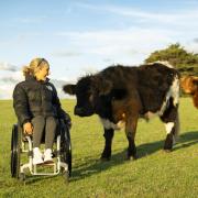 Queensland farmer and world para-surfing champion Sam Bloom on a farm tour at Lillico Farm