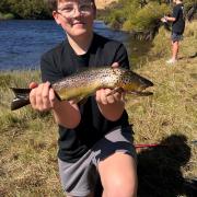 Mason Hutchison who caught his first ever trout on his first cast during a trip in the Derwent River last season.