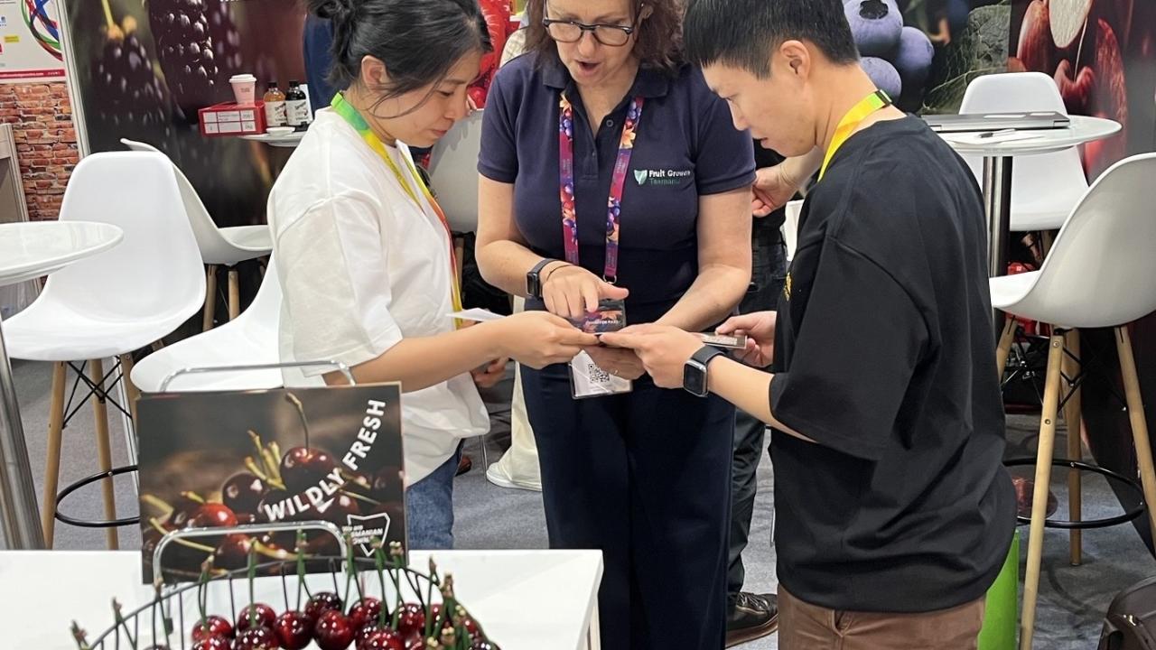 Fruit Growers Tasmania Trade and Marketing Officer Kate Dickinson assisting visitors at this year's Asia Fruit Logistica event