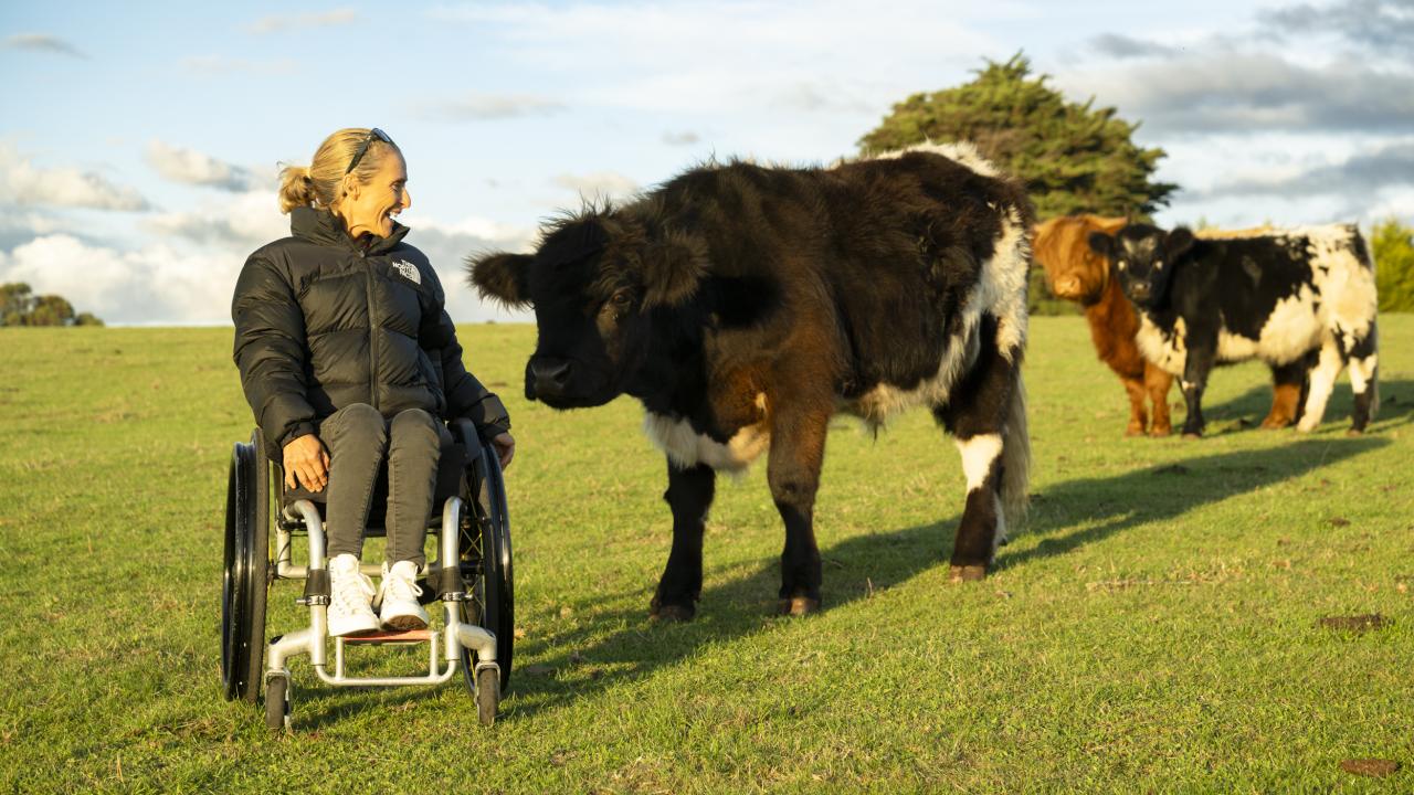 Queensland farmer and world para-surfing champion Sam Bloom on a farm tour at Lillico Farm
