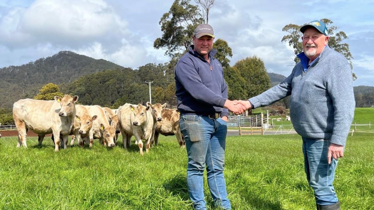 Bernard Atkins hands over his Elbern Murray Gray Stud to Troy Wright.