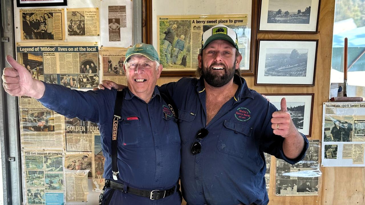 Tom Wolfe and his dad at the berry farm