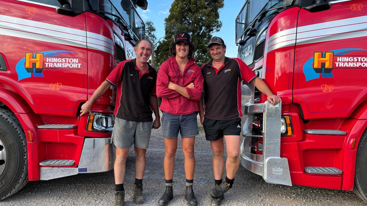 Nick Hingston and son Xavier and truck driver Justin House with two Scania livestock trucks