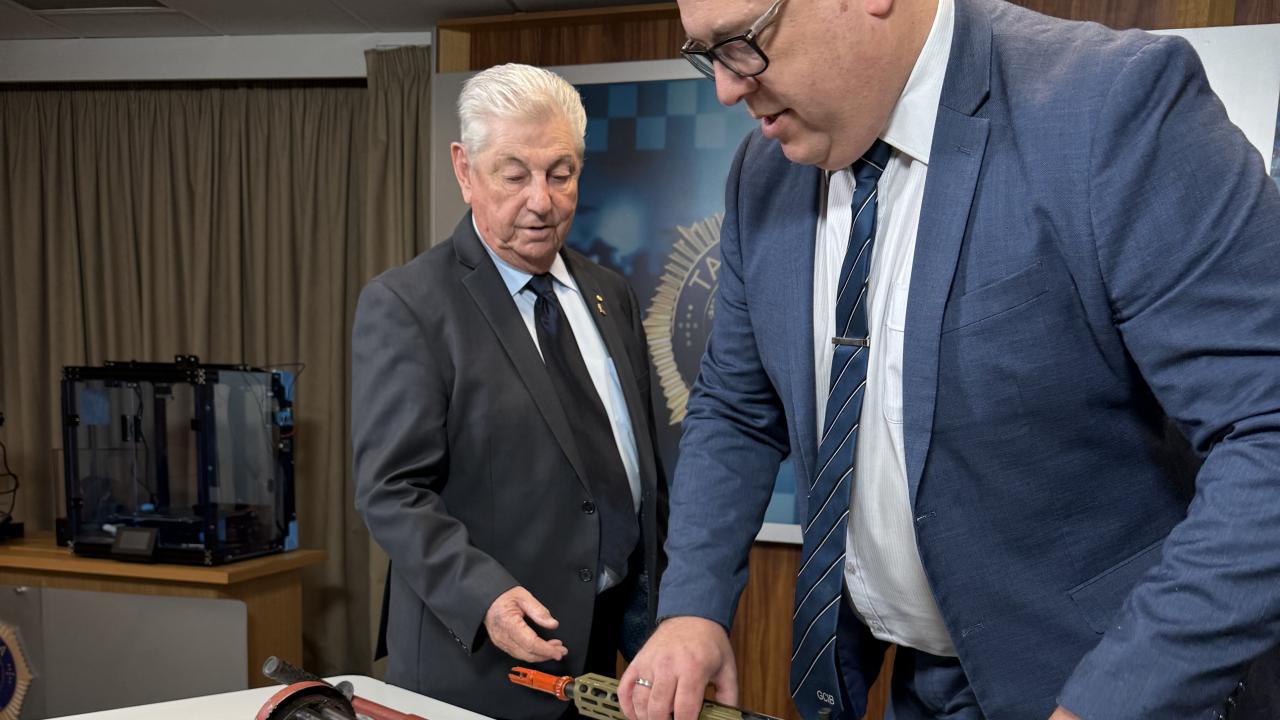 Crime Stoppers Tasmania chair David Daniels and Inspector Troy Morrisby.