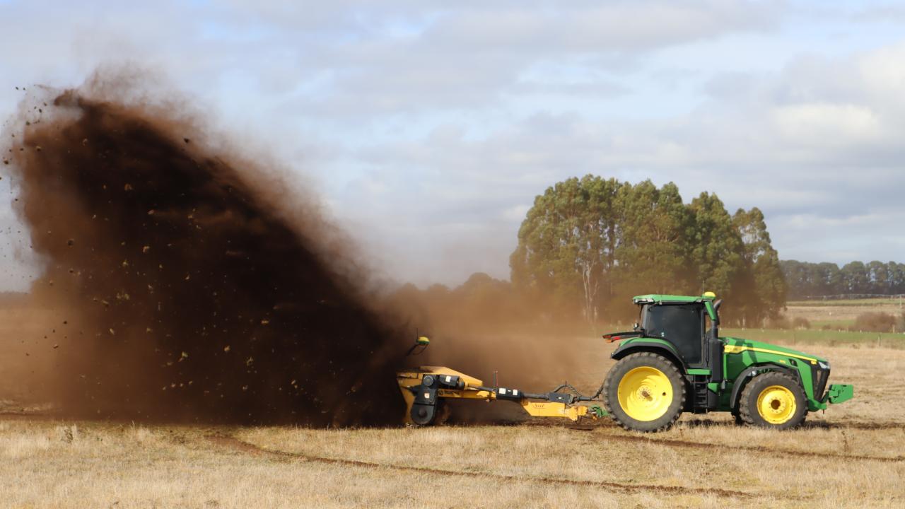 A Wolverine ditcher sends the red soil of Hagley flying