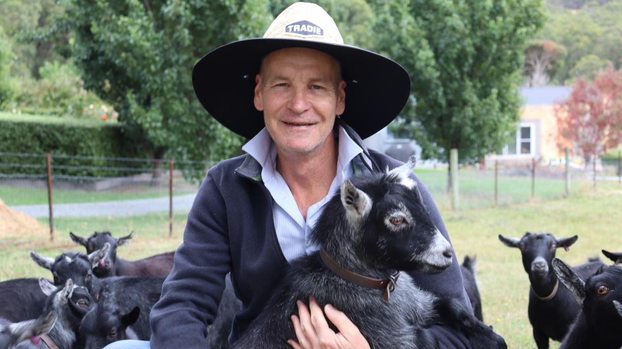 Peter Bultitude surrounded by goats