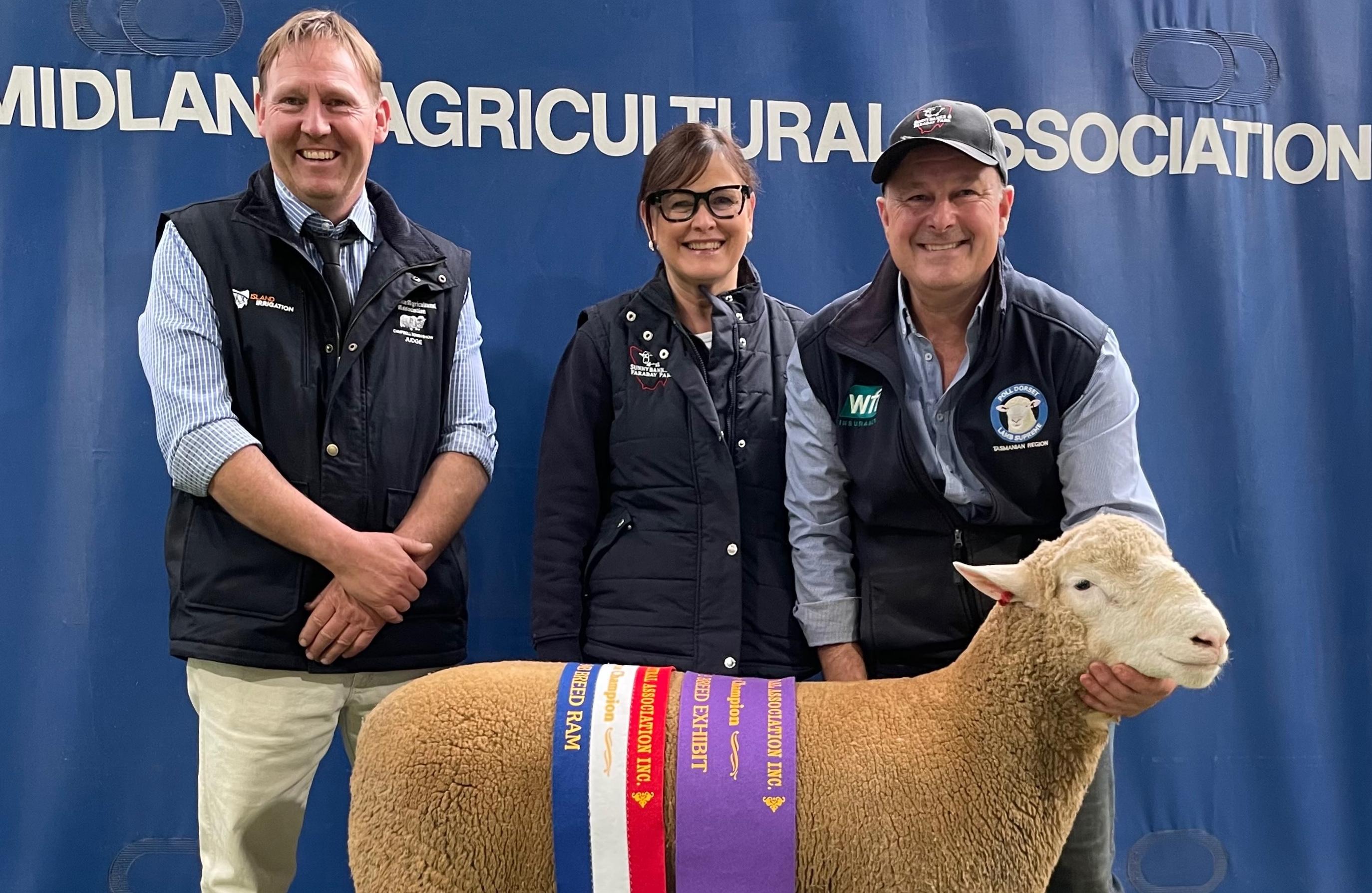 Judge Marshall Douglas with Shannon and Paul Day and their Poll Dorset Supreme Exhibit