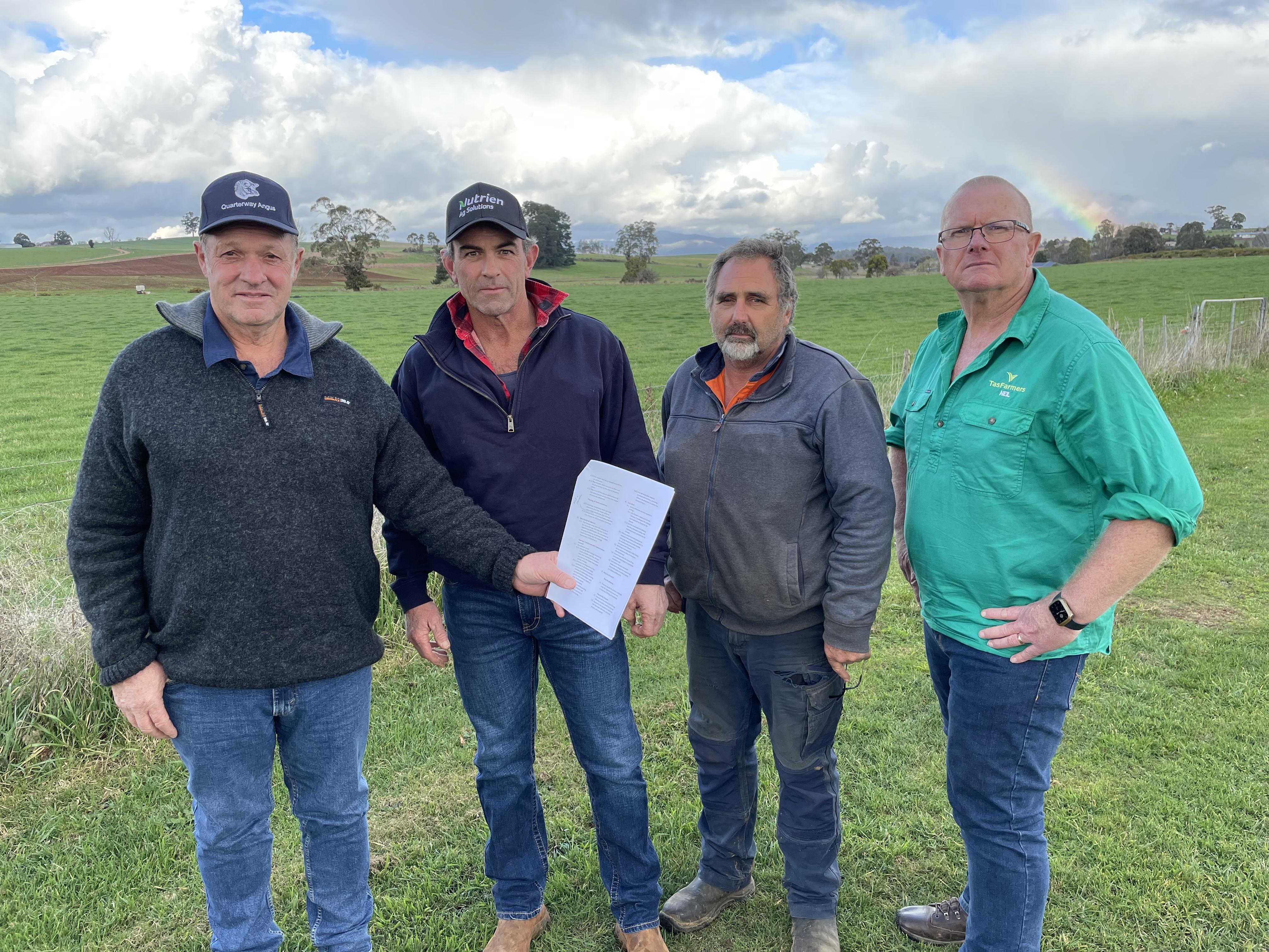 Potato growers Trevor Hall of Scottsdale, Stuart Appleby of Gawler, Ricky Elias of Bishopsbourne and TasFarmers COO Neil Grose with Simplot's rejected contract.
