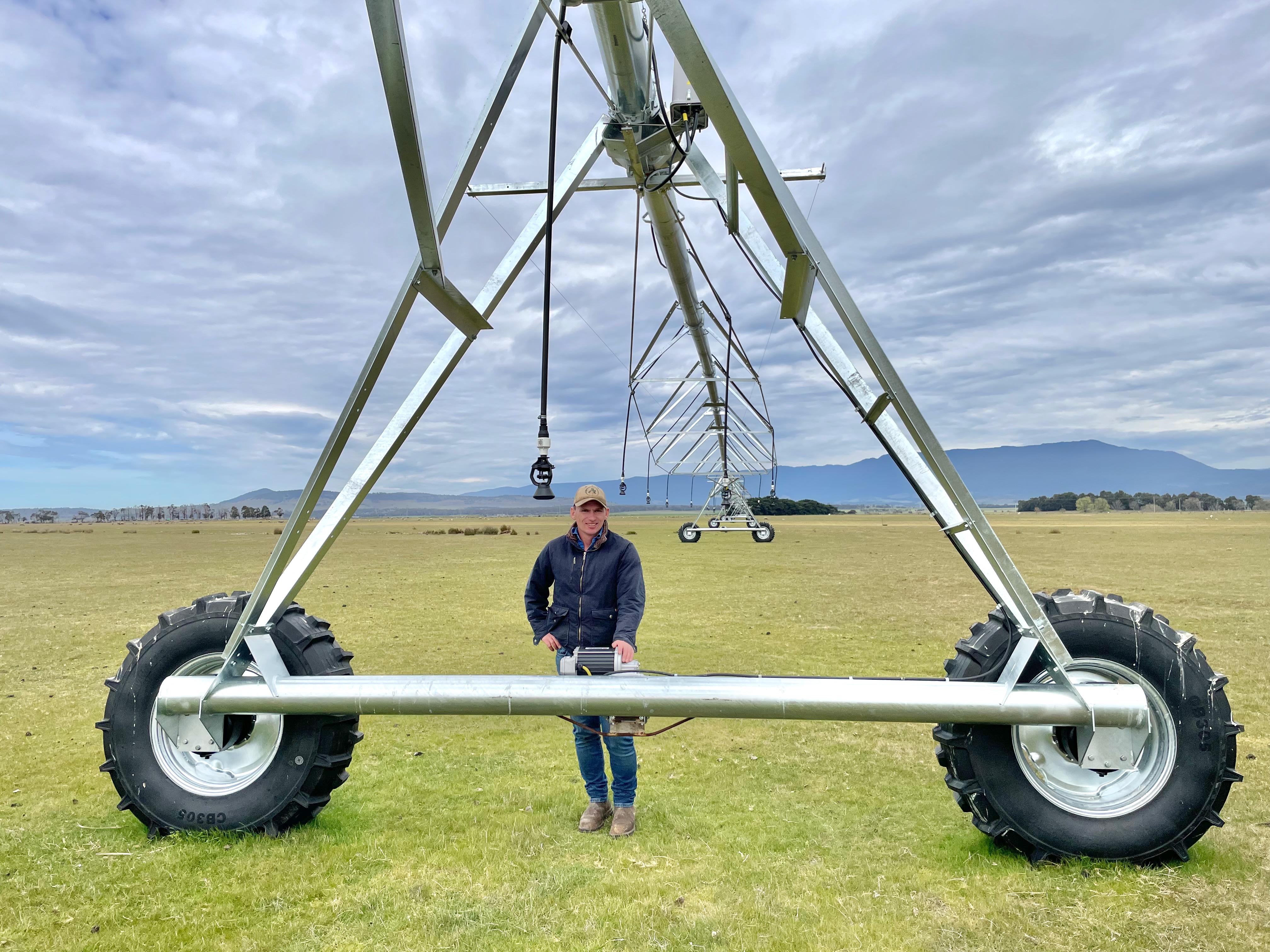 Alex Downie with a new pivot irrigator at Fairfield, Epping.