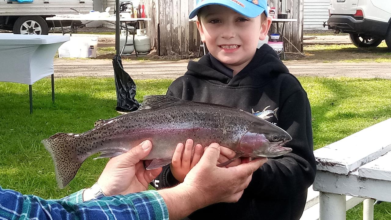 Hunter Raspin holding his winning 1.3 kg rainbow trout