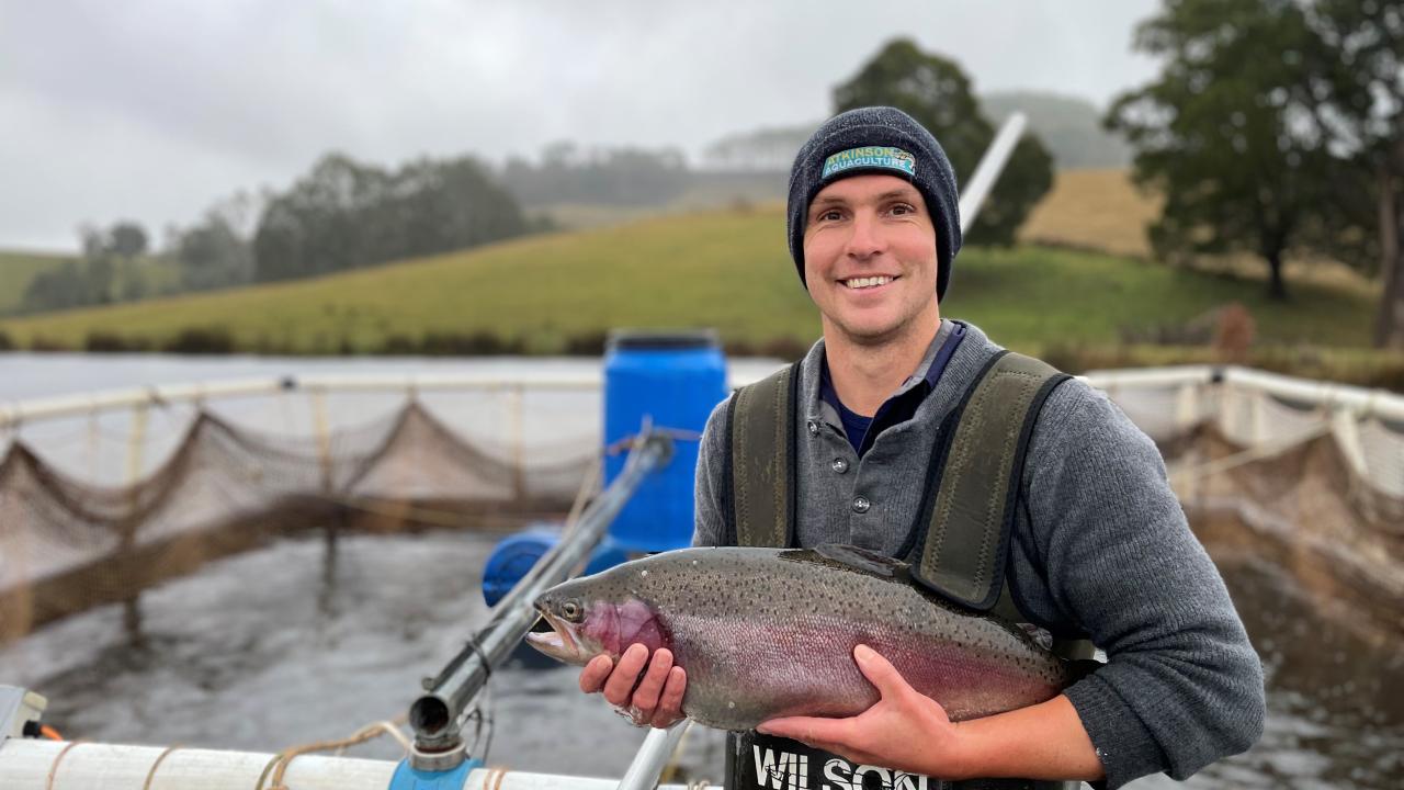 Leigh Atkinson of Atkinson Aquaculture with a trout grown out in a farm dam.