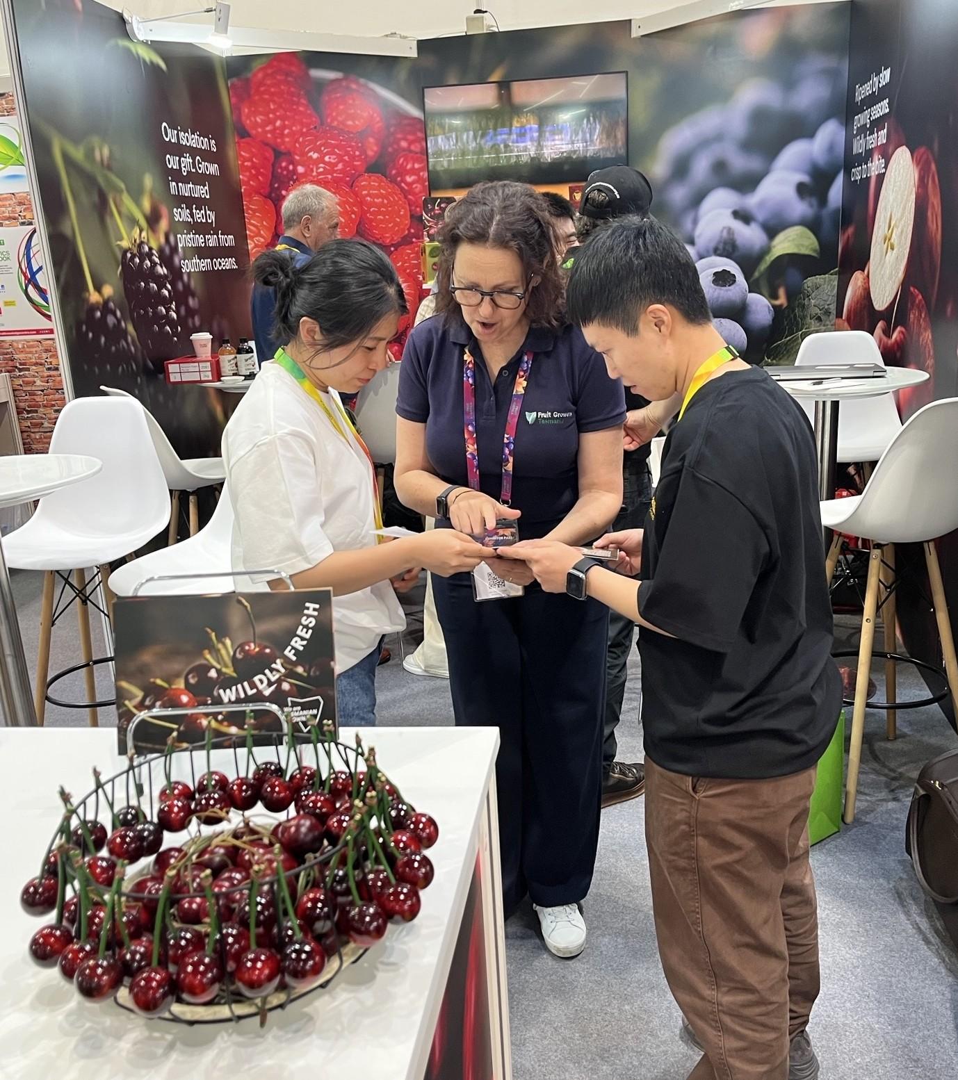 Fruit Growers Tasmania Trade and Marketing Officer Kate Dickinson assisting visitors at this year's Asia Fruit Logistica event