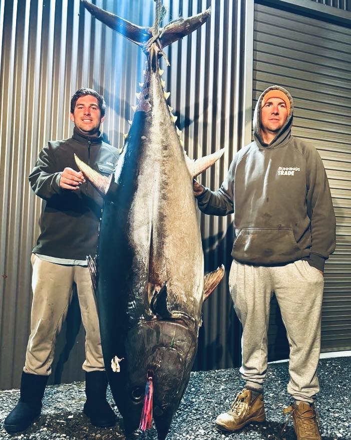 Nathan Van Der Spek with the 133.9 kg Southern Bluefin Tuna he caught off Bass Strait recently. Standing beside him is Sean Townsend