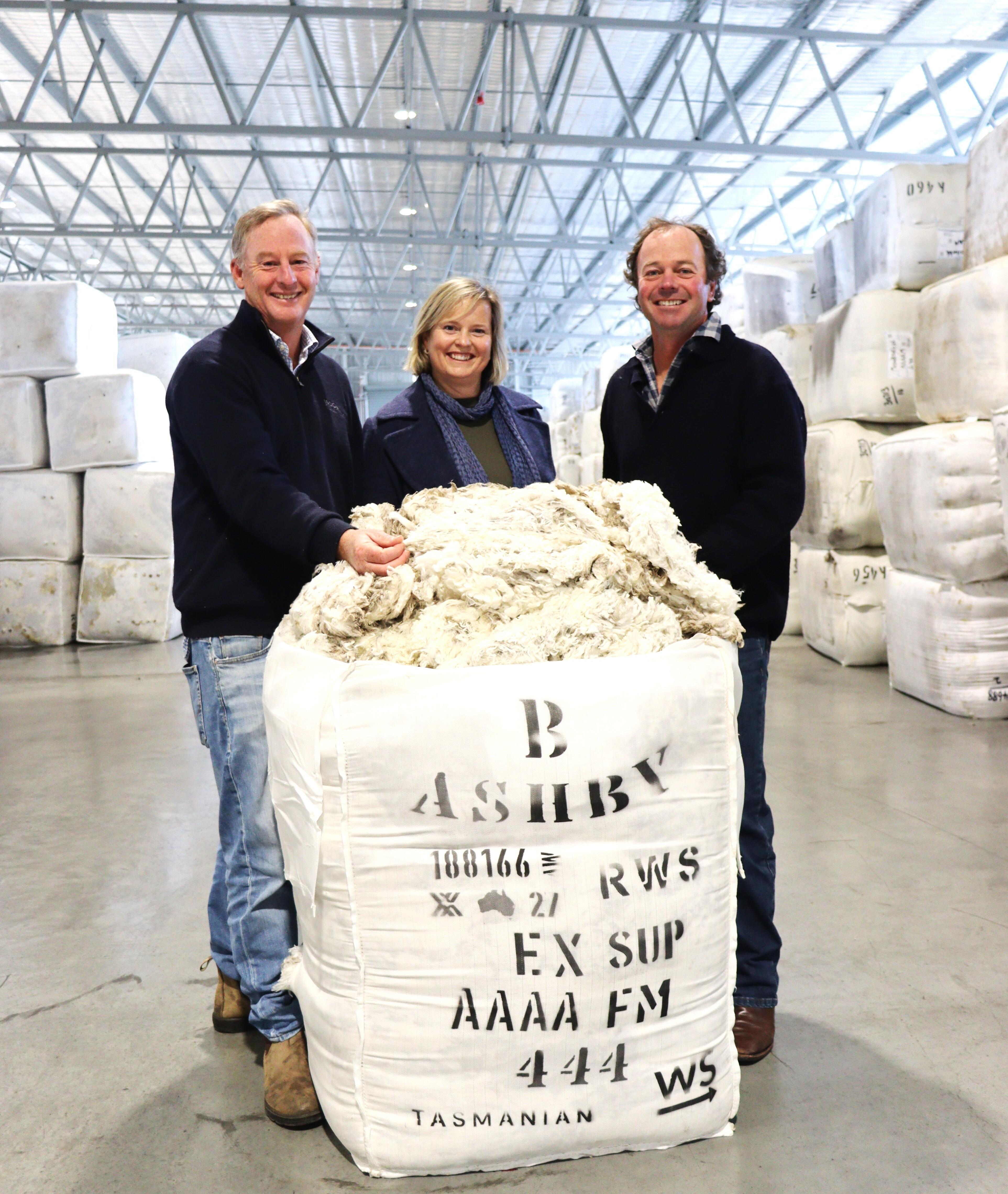 Alisatair Calvert of Wool Solutions with Nina and Will Bennett of Ashby, Ross, which has produced a superfine bale of wool that fetched $330 per kilo at auction.
