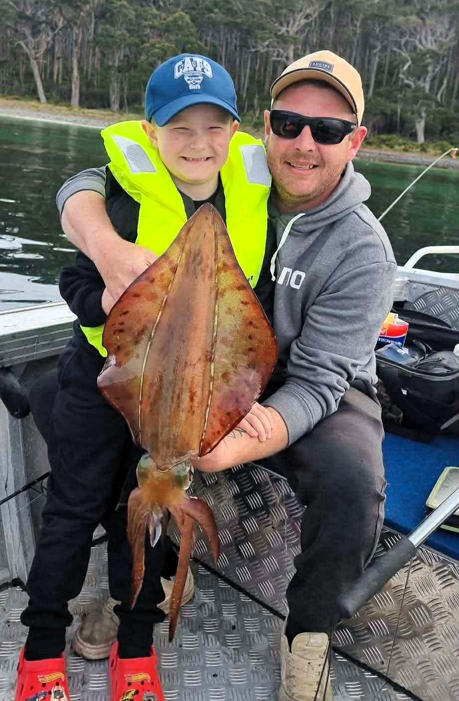 Bailey Withers with his dad Luke and a big Southern Calamari Squid Bailey caught last weekend during the opening of the Squid season /Southern zone.