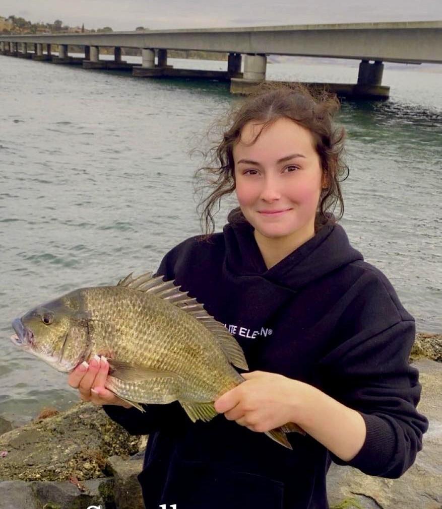 16-year-old Treasure Williams with a big Black Bream she caught on bait from Midway Point recently.