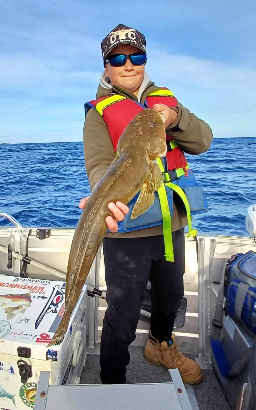 Jayden Slater, 11 with a 70cm Southern Bluespot Flathead he caught off Bridport recently.