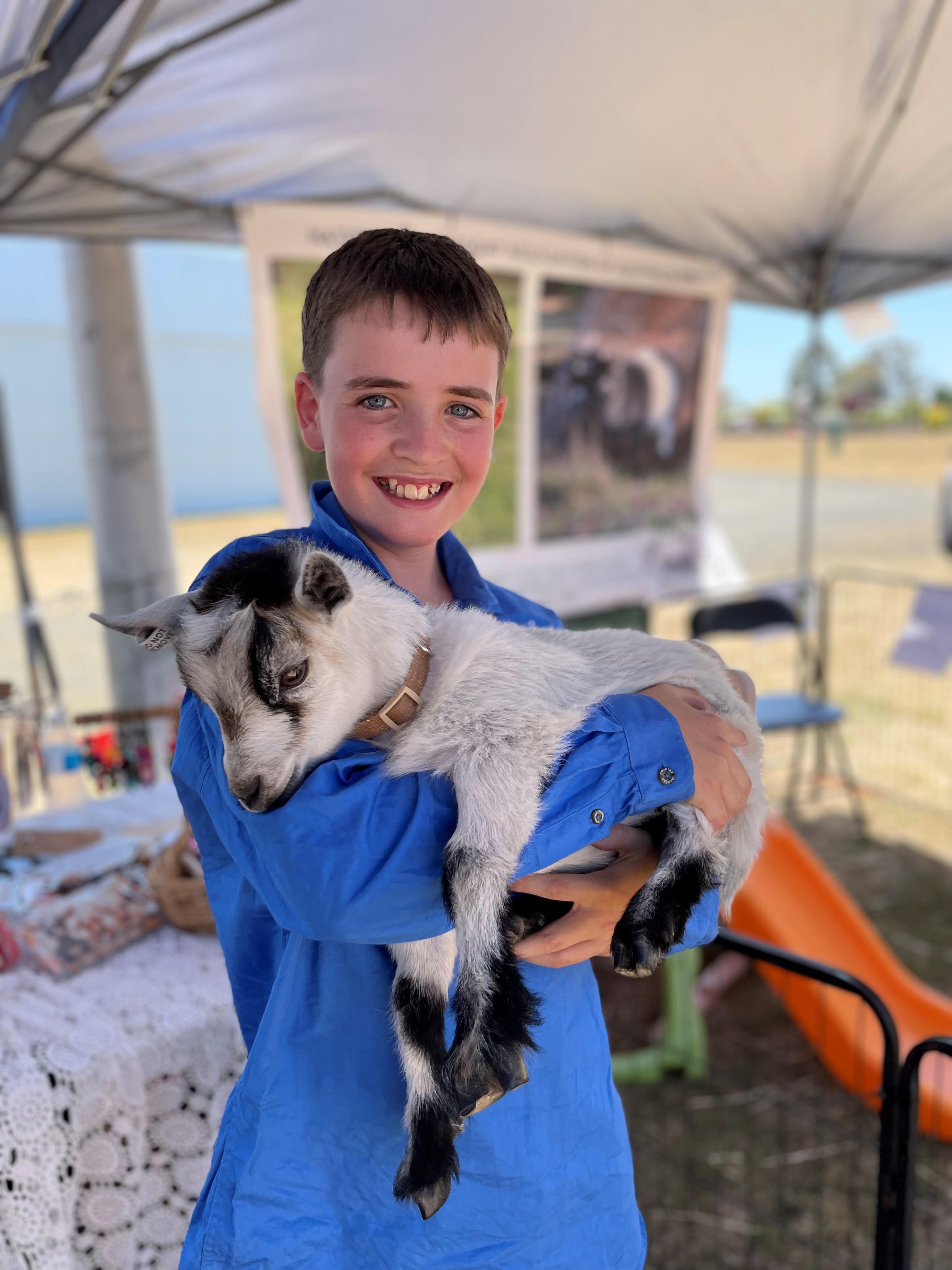 Baxter Rowbottom with Gracie the pygmy goat