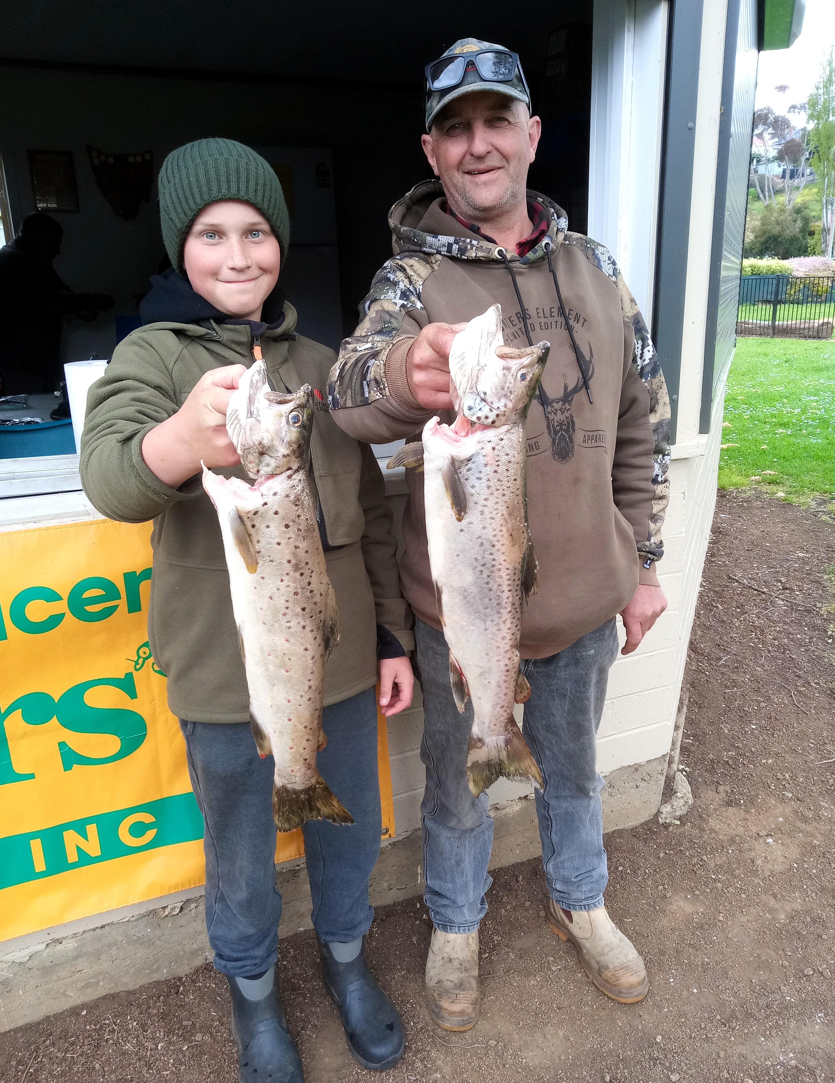 New Norfolk Licensed Anglers Association members Adrian Slater and his son Jayden with their winning catches from last weekend’s Derwent River competition.