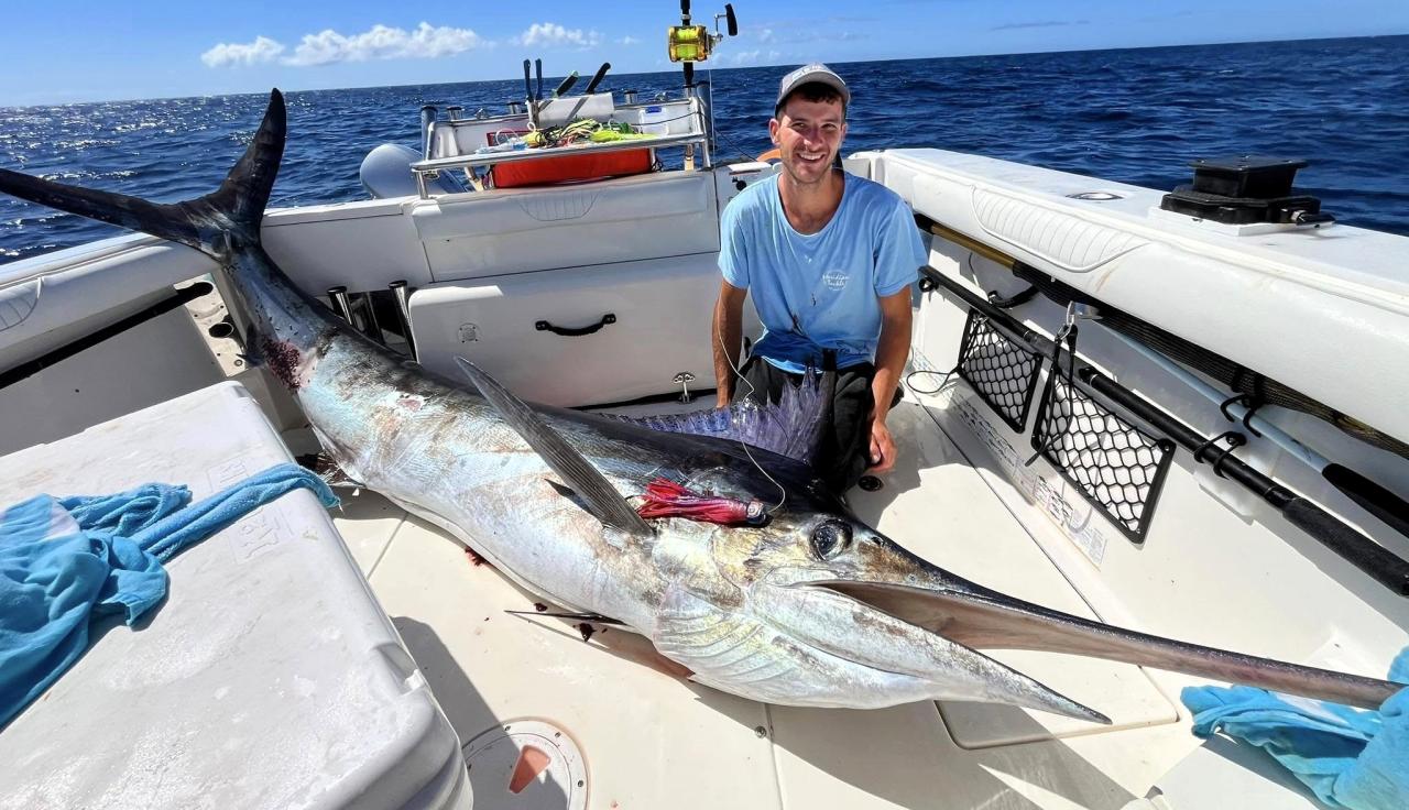 Antony Suttil with the 138 kg uncleaned Striped Marlin he caught at the St Helens Gamefishing Classic.