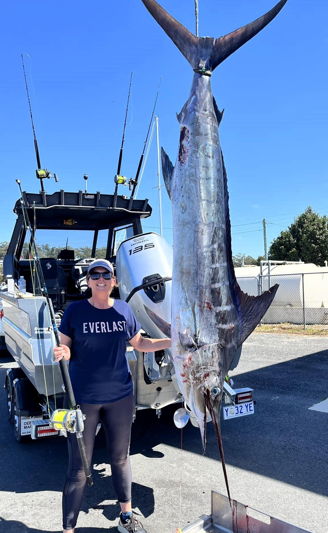 Vanessa Barnes with the 87.6 kg Striped Marlin she recently caught.