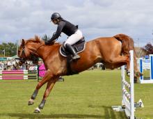 Adele Rechber of Launceston clears the final jump in the 90cm Open on Glenara Albus.