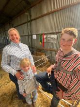  Edwina Caswell with daughter Molly, 7, and Harry, 13, with their Reserve Champion Merino ram from Glen Stuart, Deddington.