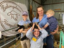 Lizz Wright of Balongdaus Hampshire Downs at Pontville with helper Hunter Powe, 13, and sons Gauge Johnston, 7, and Henry Johnston, 3, plus two of their lambs, Ritz and Kruskitt.