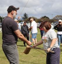  Simone Gill of Trevallyn gets some tips for tossing the sheaf.