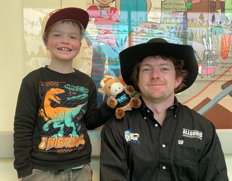 Jacob Hall with bull rider Josh Clark