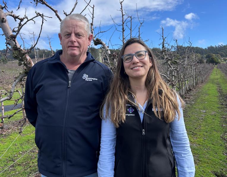 Rodney Hogan of Montague Farms and tree crop physiologist Leticia Reis