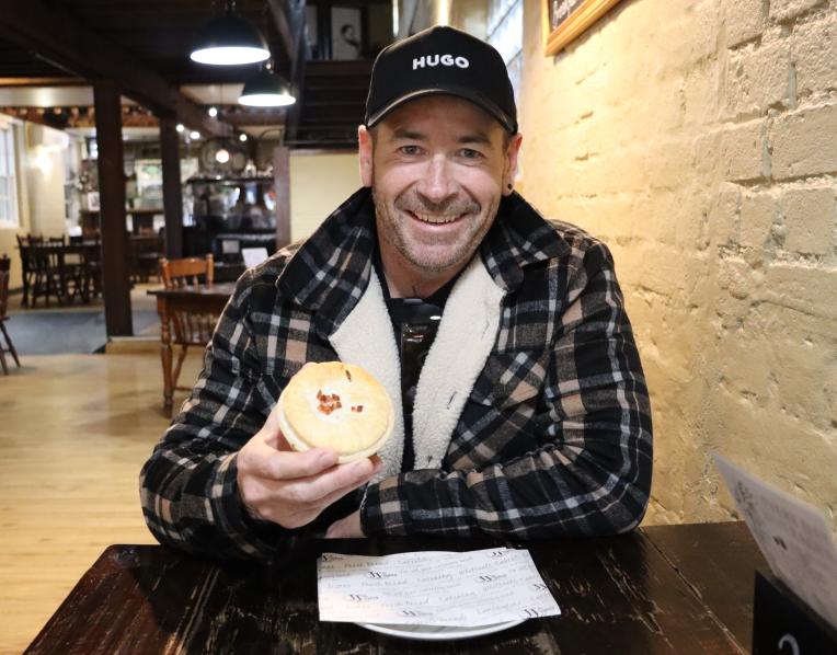  JJ’s owner Nathan Johnson with a maple bacon and brisket pie.