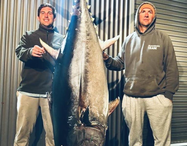 Nathan Van Der Spek with the 133.9 kg Southern Bluefin Tuna he caught off Bass Strait recently. Standing beside him is Sean Townsend